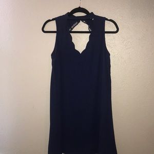 Navy blue mini dress with scalloped detailing!